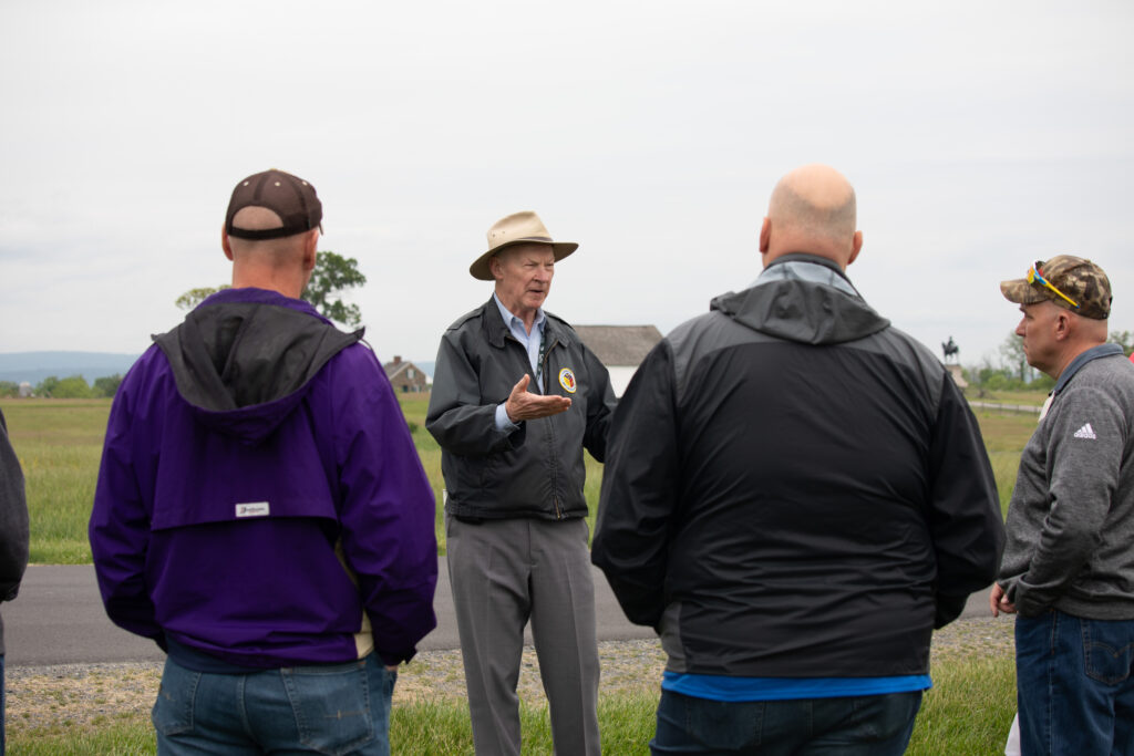 Battlefield guide speaking to participants outside